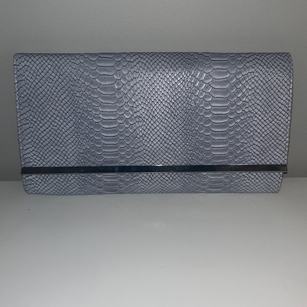 Atmosphere grey snake embossed faux leather clutch with silver hardware.